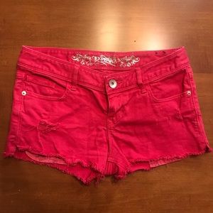 Express red denim distressed shorts